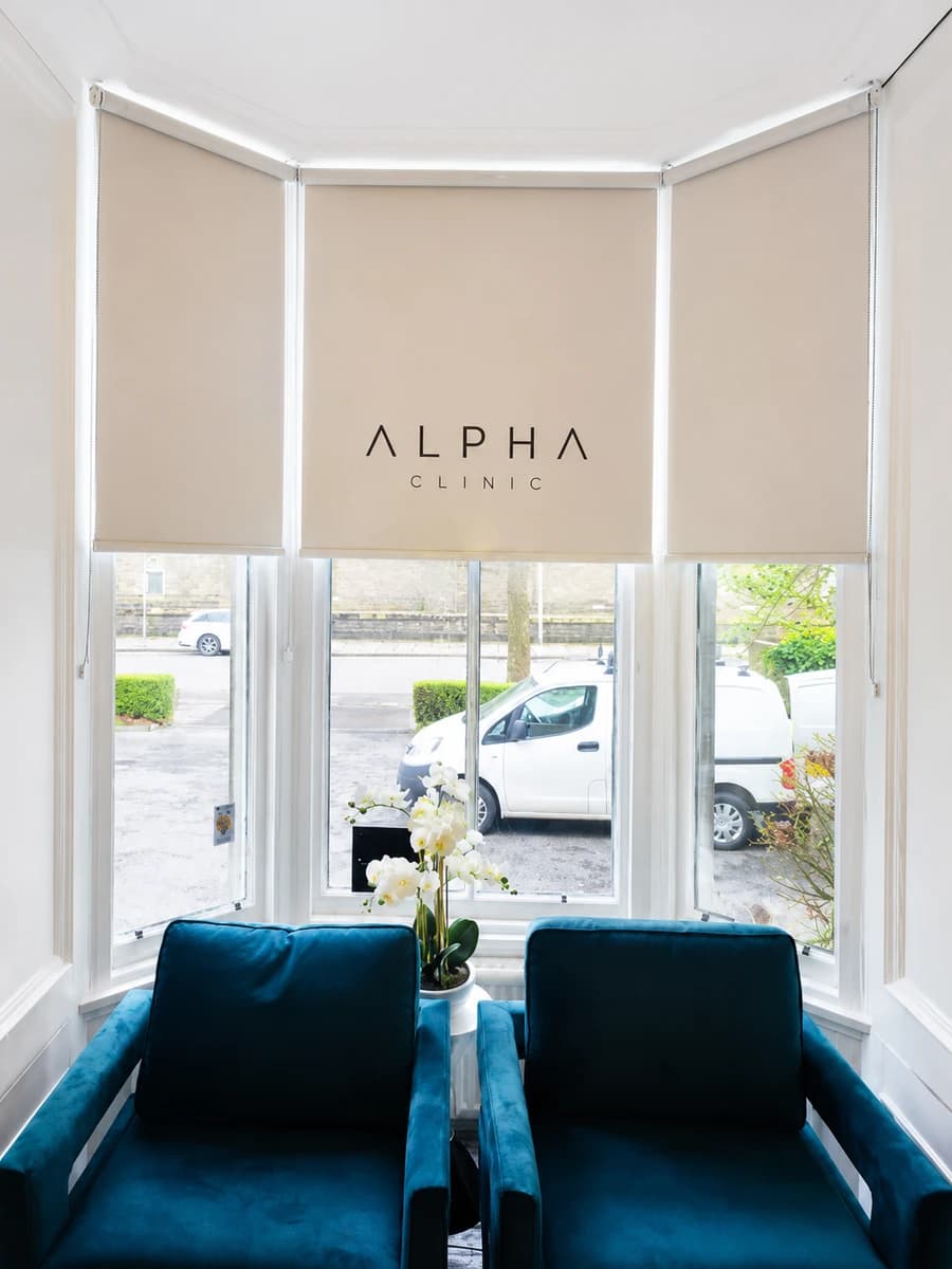 Alpha Clinic healthcare bay window with logo printed roller blinds