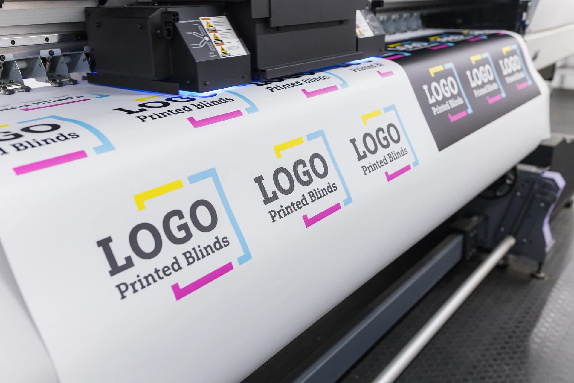 Commercial printing press producing logo printed blinds