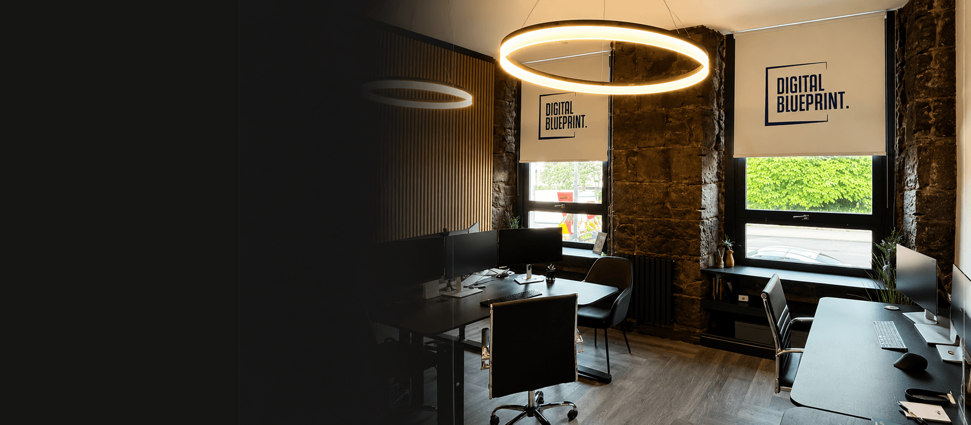 Digital Blueprint branded office roller blinds in contemporary commercial space