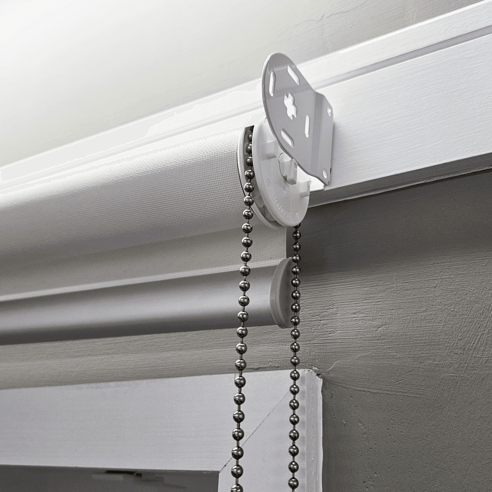 Fit each end of the roller blind securely into brackets