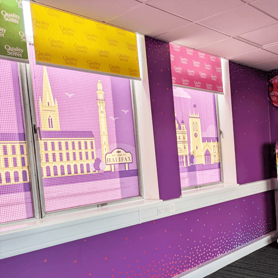 Close-up of Welcome to Halifax Quality Street printed blinds with multi-colour pelmets