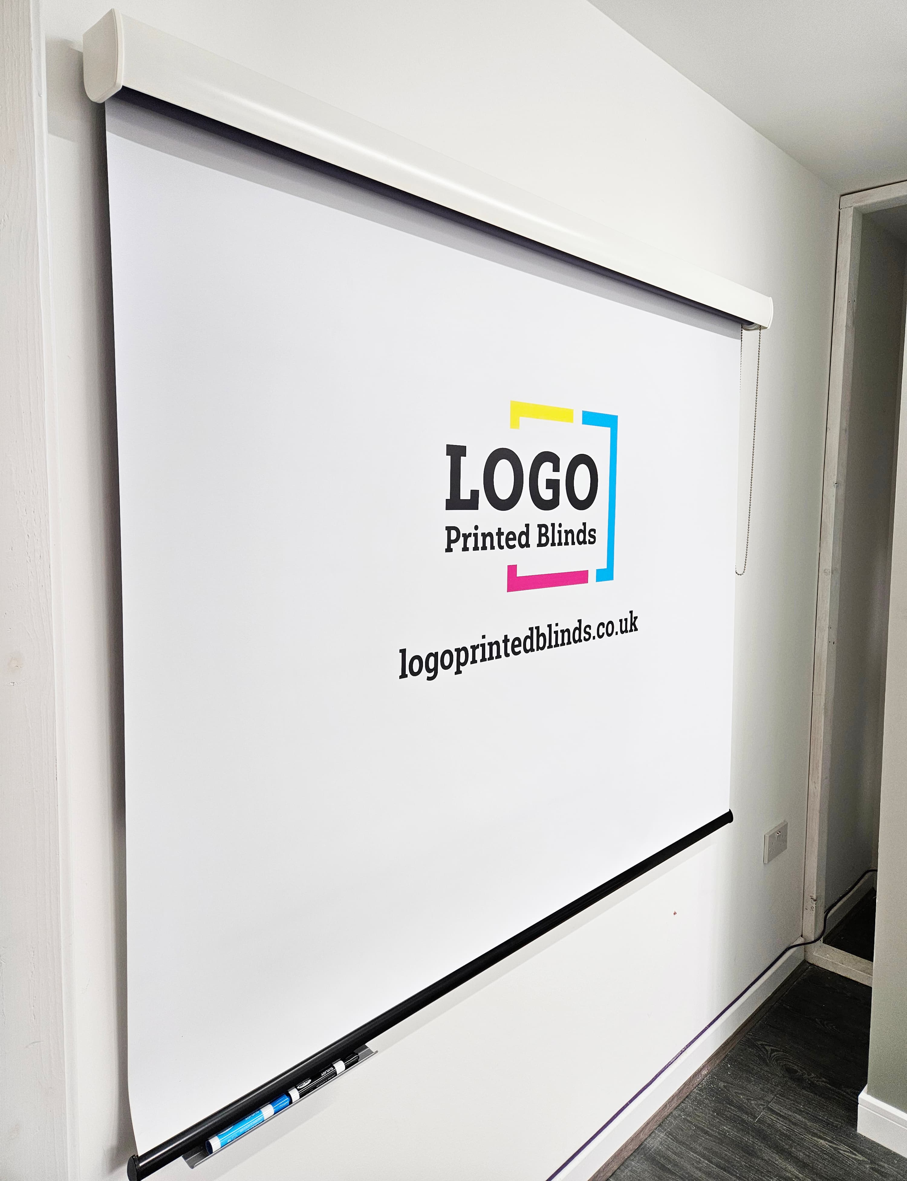 Logo printed whiteboard roller blind fitted over office whiteboard